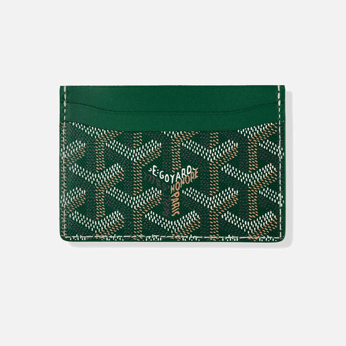 Green coated canvas card holder by Goyard featuring the signature all-over monogram pattern with contrasting white stitching and a central logo detail.
