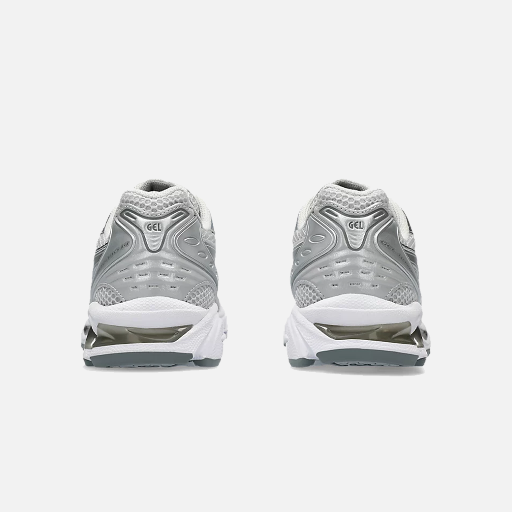 A pair of ASICS Gel-Kayano 14 Cloud Grey running shoes for women, featuring a mesh upper with grey accents and a midsole with GEL technology for cushioning, Back view.