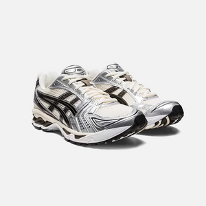 ASICS Gel-Kayano 14 Cream Black Metallic Plum sneaker with leather and mesh upper, visible cushioning and support features, Side view.