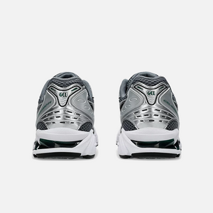 ASICS Gel-Kayano 14 Metropolis Jasper Green sneaker with dark grey mesh base, metallic silver leather overlays, and vibrant green details, Back view.