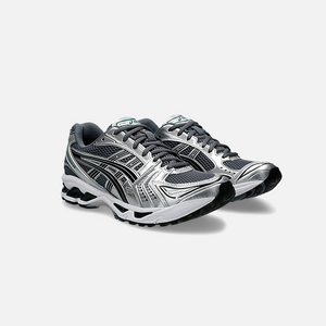 ASICS Gel-Kayano 14 Metropolis Jasper Green sneaker with dark grey mesh base, metallic silver leather overlays, and vibrant green details, Side View.