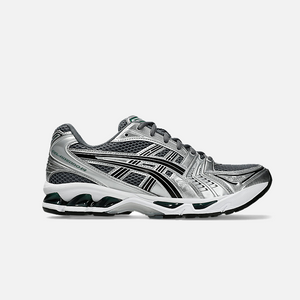 ASICS Gel-Kayano 14 Metropolis Jasper Green sneaker with dark grey mesh base, metallic silver leather overlays, and vibrant green details.