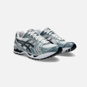 ASICS Gel-Kayano 14 Fjord Grey sneaker with a combination of grey, blue, and white colors, showcasing the side profile of the sneaker with mesh material and cushioning technology. Side View.