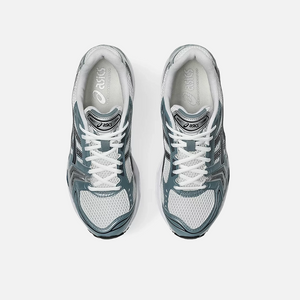 ASICS Gel-Kayano 14 Fjord Grey sneaker with a combination of grey, blue, and white colors, showcasing the side profile of the sneaker with mesh material and cushioning technology. Top View.
