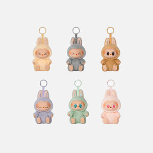 Set of five Labubu plush keychains with different colored outfits on a white background