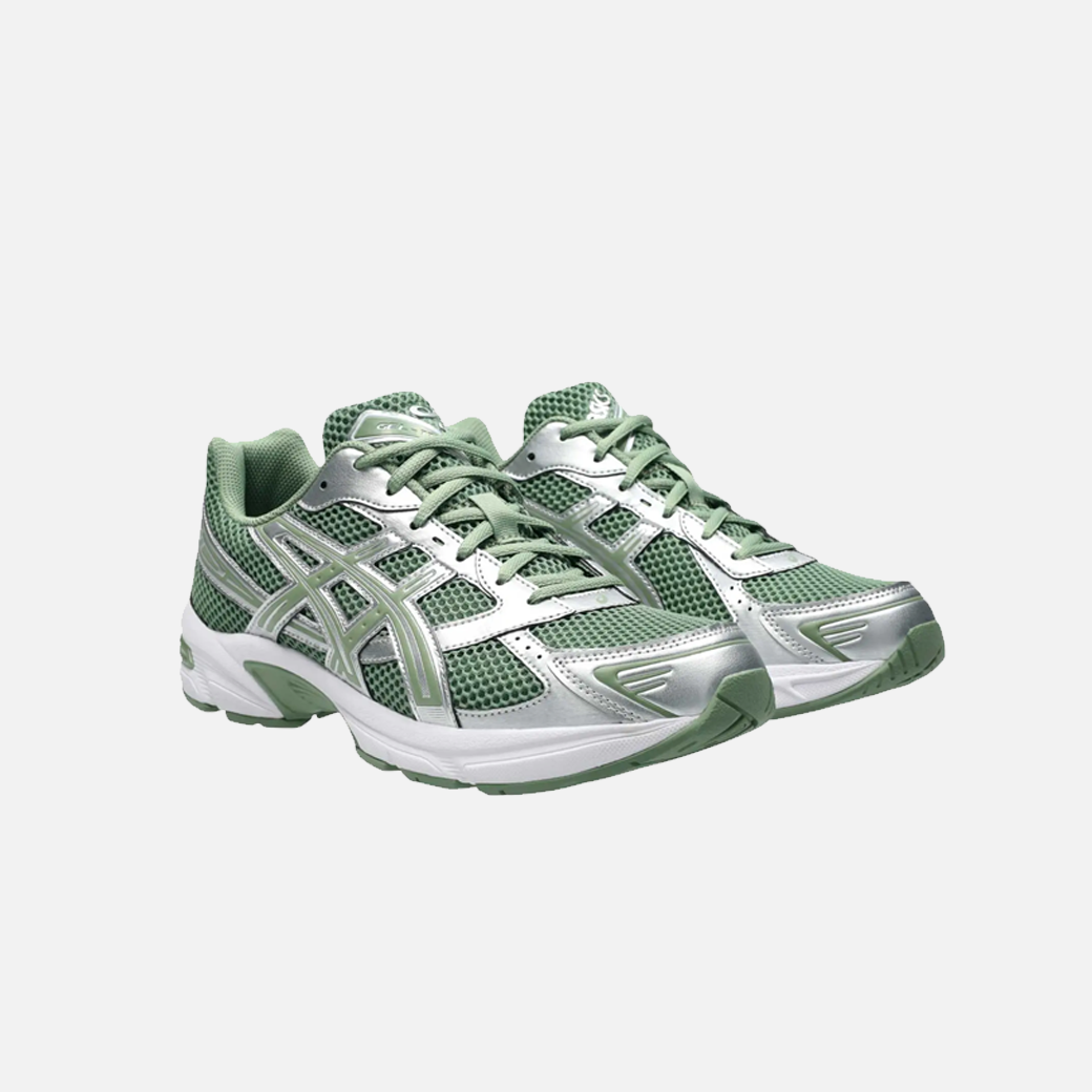ASICS Gel-1130 running shoe in swamp green, white, olive, and silver colors, with a mesh upper and a flat sole. Side View.