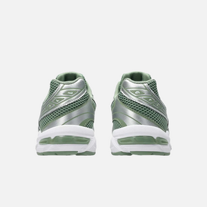 ASICS Gel-1130 running shoe in swamp green, white, olive, and silver colors, with a mesh upper and a flat sole. Back View.